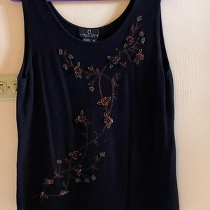 Black tank with design of flowers on a branch